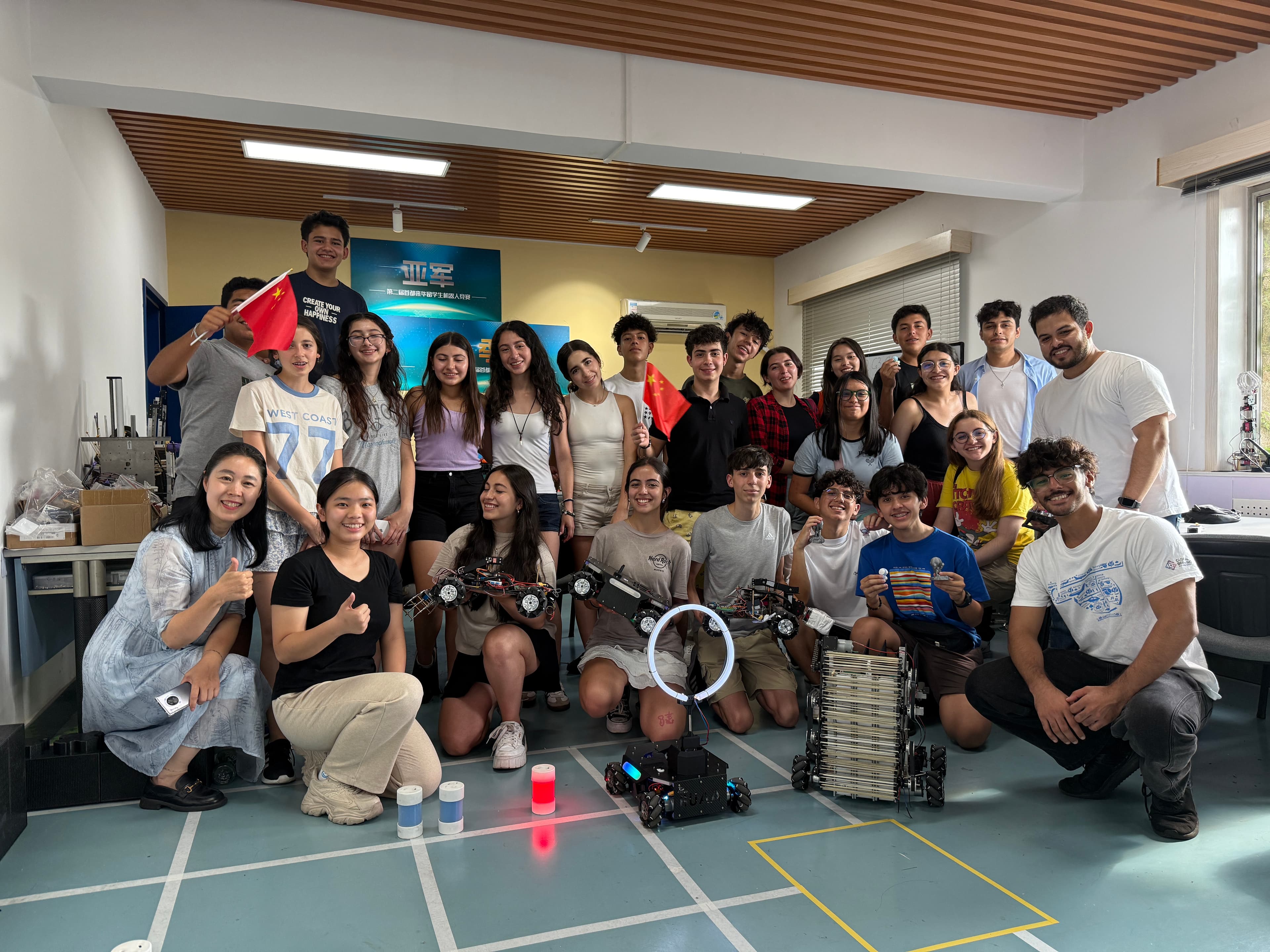 International student group sharing a robotics experience