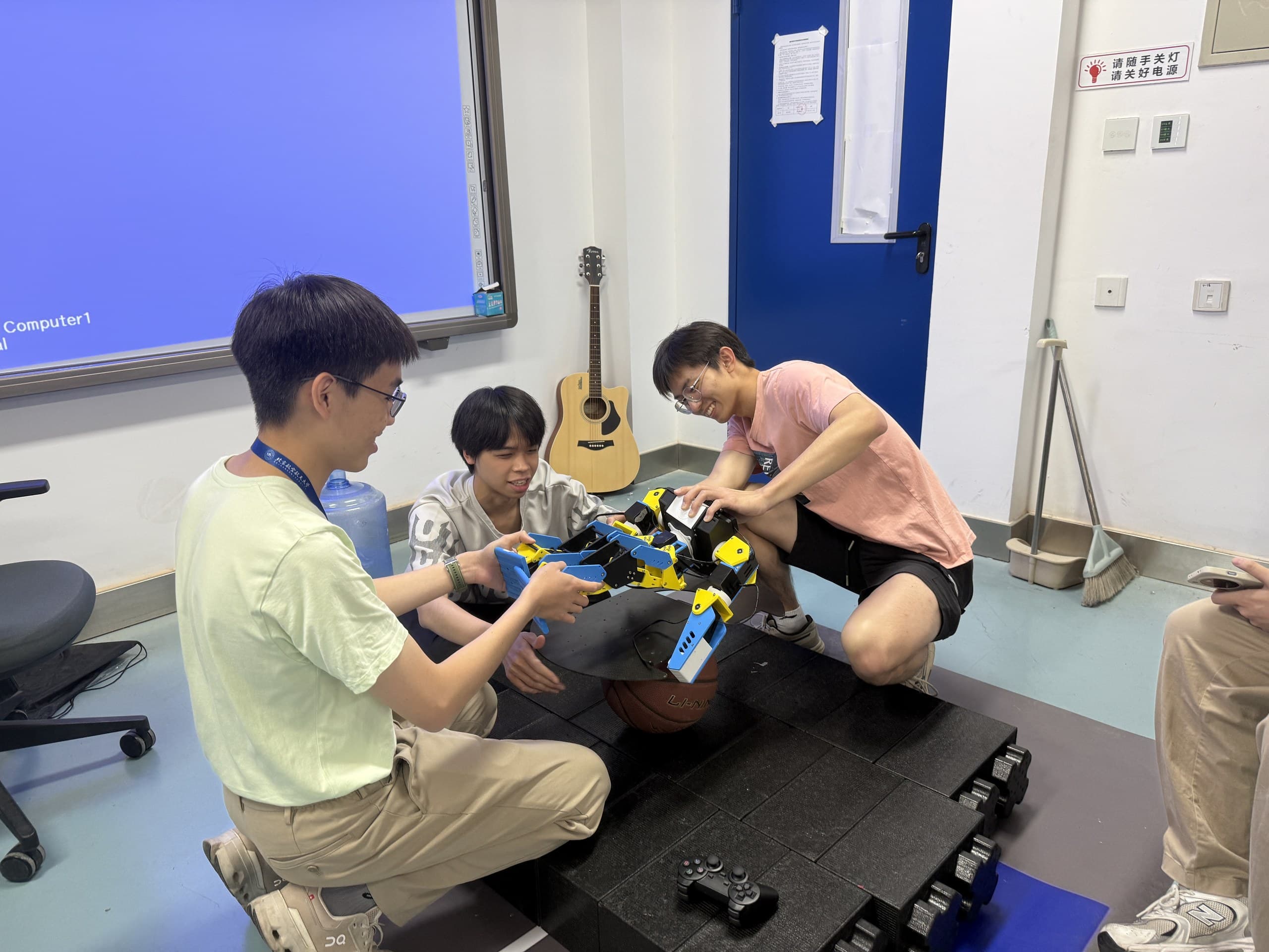 ISRC students assembling the 17-DOF humanoid robot in the laboratory